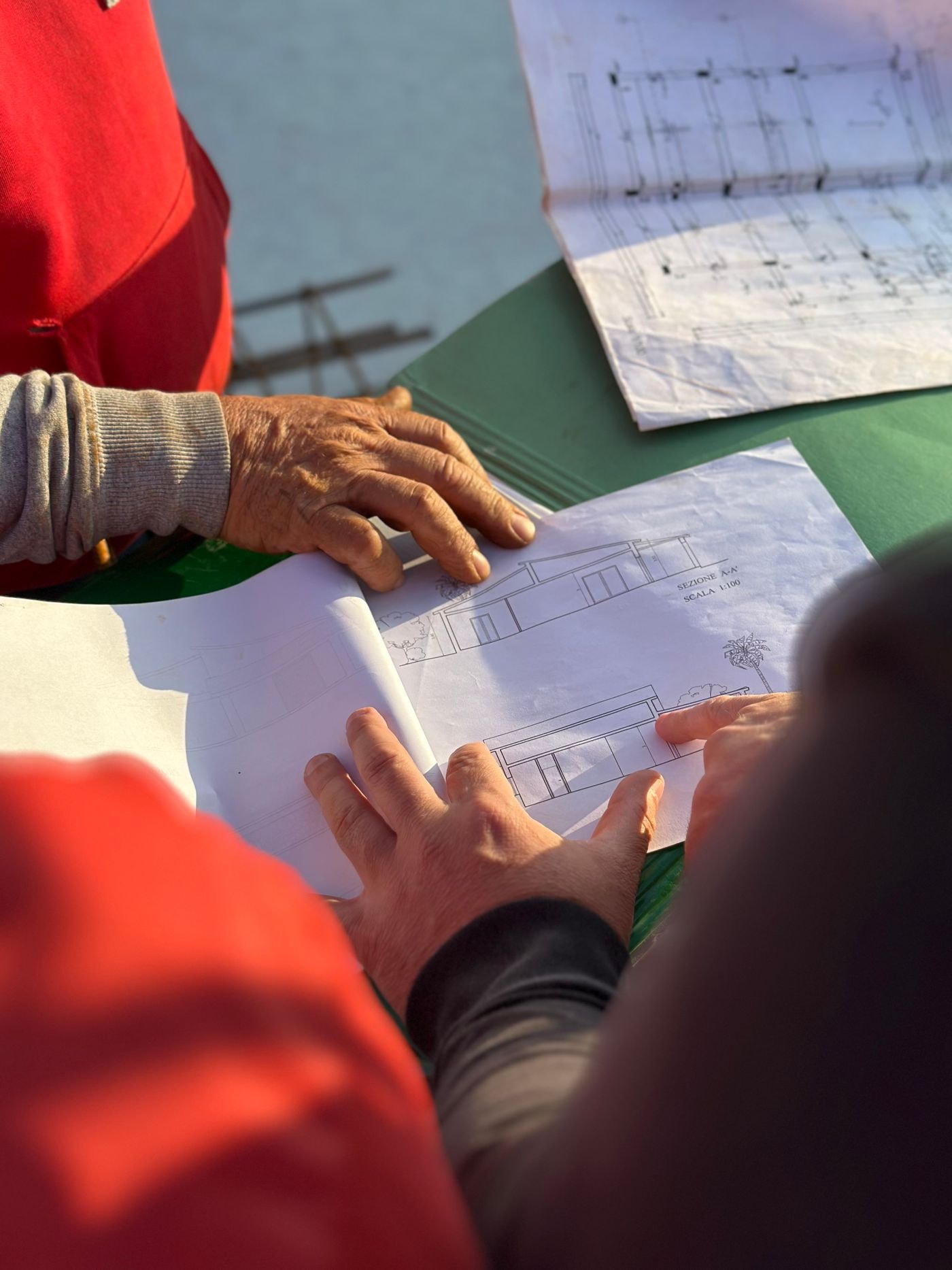 Reviewing construction blueprints on site