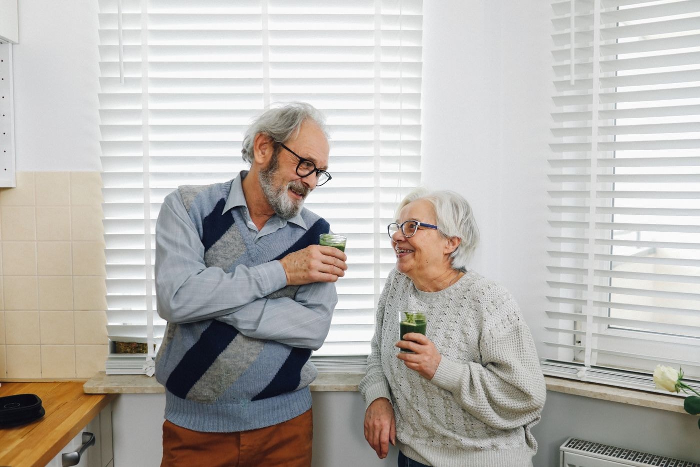 Senior couple together at home in their kitchen