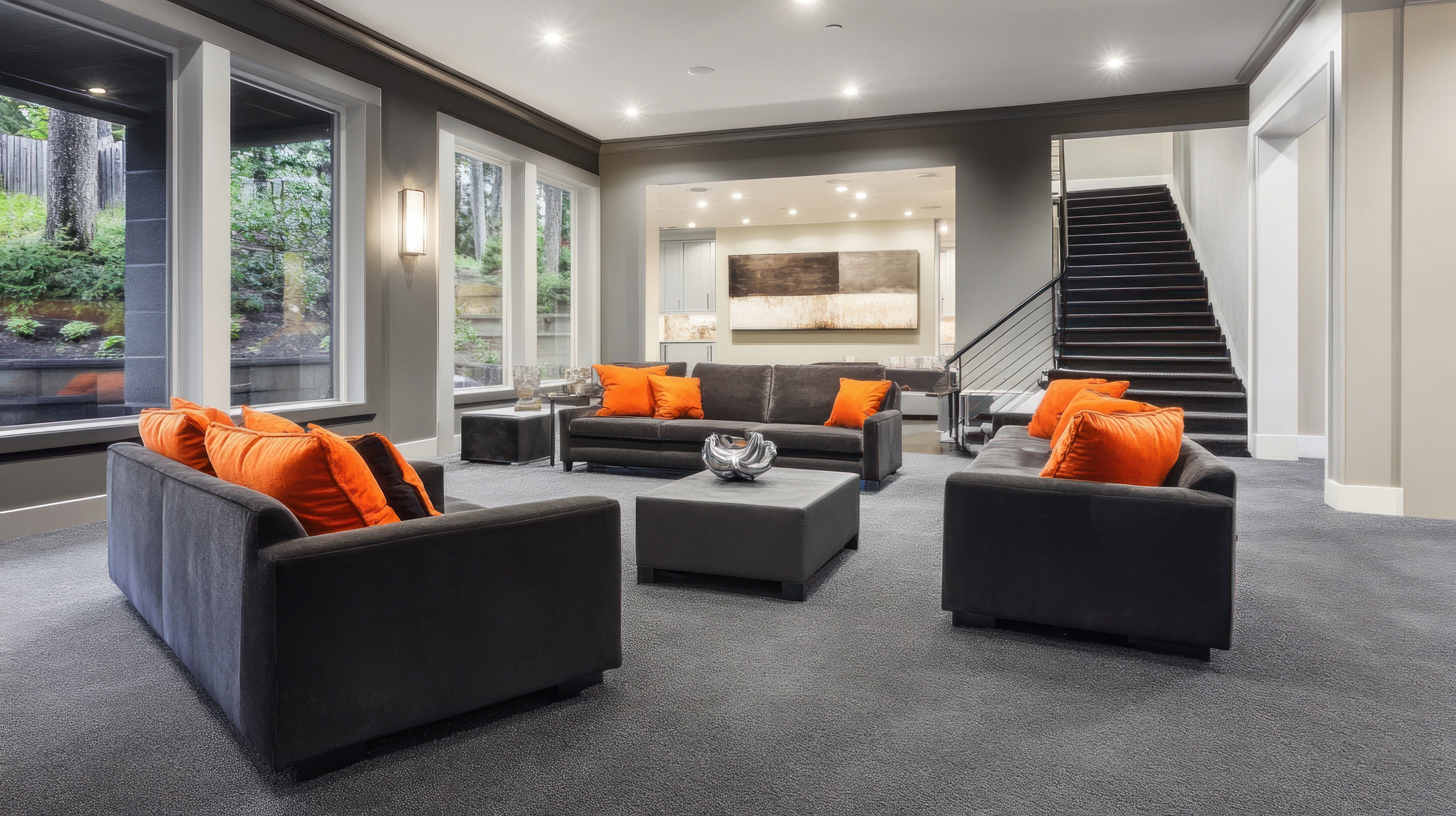 Whole-home remodeling living area with orange accent pillows